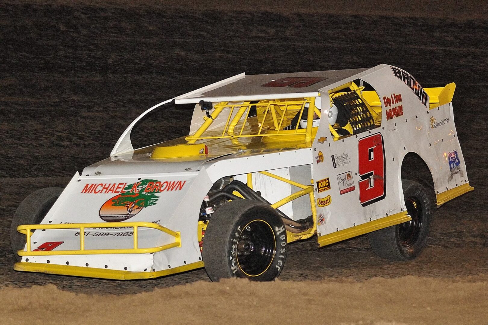 A dirt track race car with the number 9 on it.