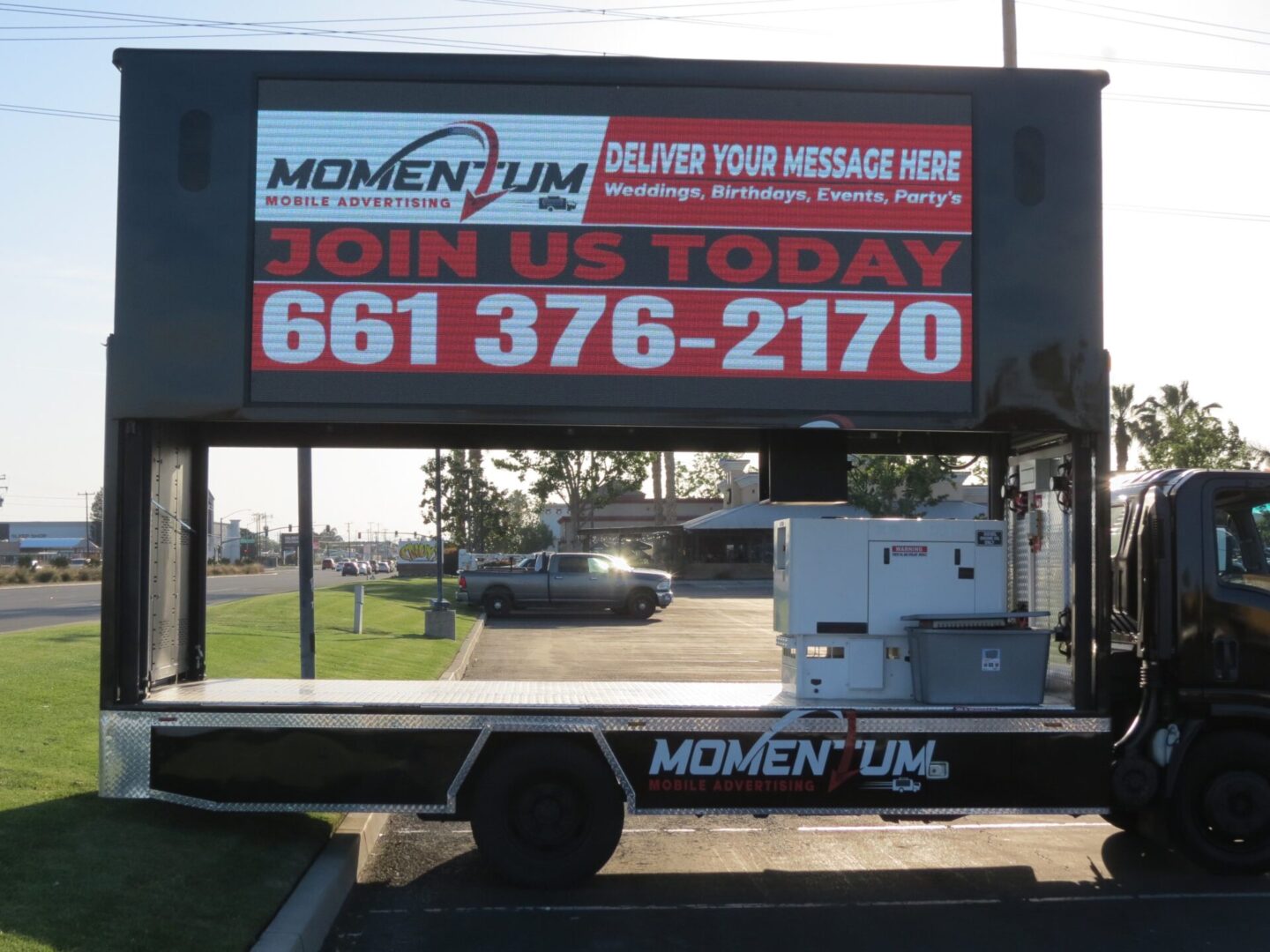 A large truck with a sign on it's side.